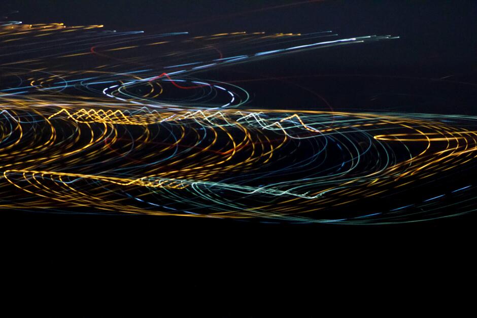 a blurry photo of lights in the dark
