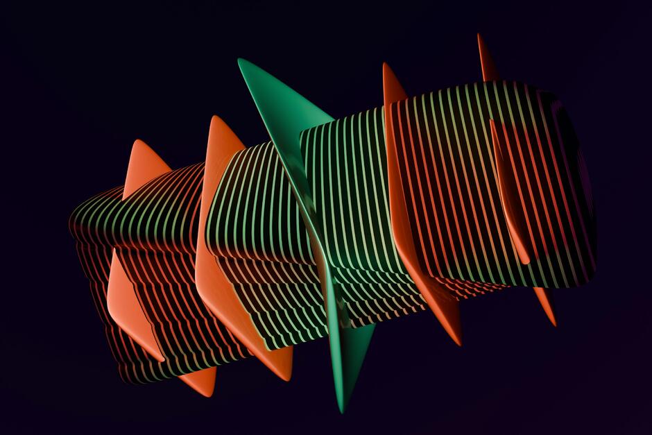 A group of orange and green objects against a black background