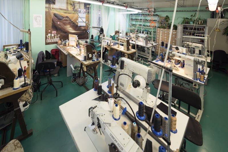 Shoe Factory. Female Worker on a Sewing Machine. Editorial Photo ...